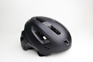 Fototapeta premium Black helmet on white. This helmet is used to practice cycling. Bike helmet. Black bicycle helmet. Isolated on white, clipping path included. 