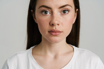 Young brunette woman posing and looking at camera