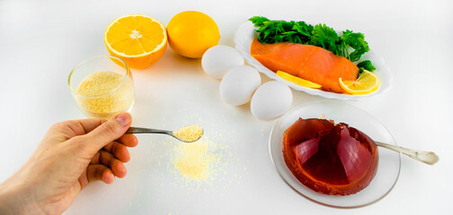 Jelly, gelatin powder and eggs are the main foods containing collagen, essential for youthful skin and healthy joints. Light pink background. Copy space. Flat lay.