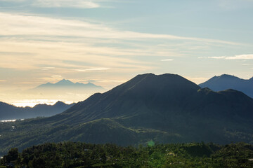 Fototapeta na wymiar Three Balinese volcanoes at dawn