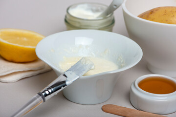 Ingredients for Potatoes facial mask: potatoes, honey, lemon, yogurt. Homemade skin care product.