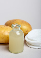 Obraz na płótnie Canvas Potatoes juice. Homemade skin care product.
