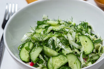 Diet salad of cucumbers and cabbage. Healthy diet. Vegetarian food