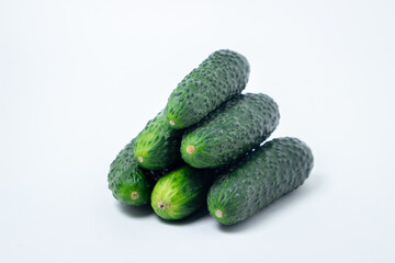 Cucumbers on a white background. Fresh ripe cucumbers.