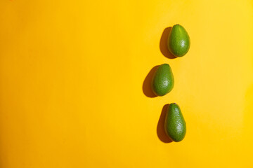 Fresh avocados on color background