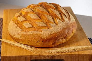 Images of freshly baked bread on a wooden table