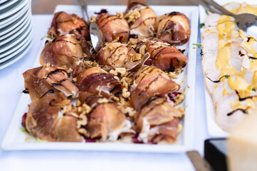 Tray with gourmet appetizer in a buffet.