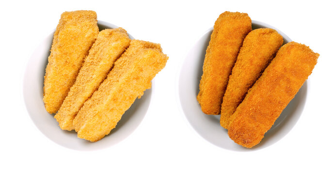 Vegan fishless fingers, pre-fried and deep-fried, in white bowls. Fishless sticks, based on soy protein, breaded and crispy coated. Fast food. Close-up, from above, isolated, over white, food photo.