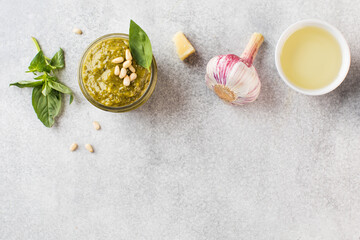 Homemade pesto sauce with basil leaves, garlic, olive oil. Top view. Copy space.
