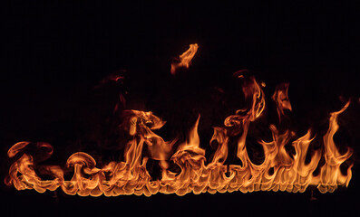 Fire flames on black background, close-up