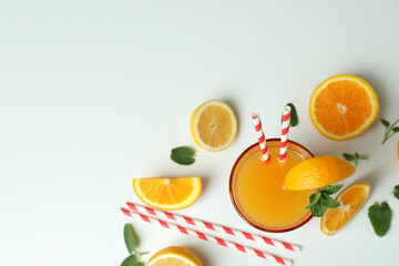 Tequila sunrise cocktail and ingredients on white background