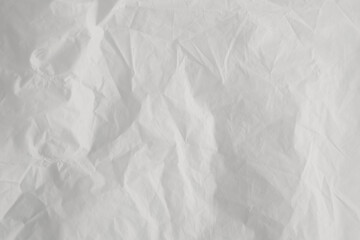 White feathers on a white background