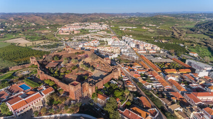 Fototapeta na wymiar The Portuguese historic village of Silves, Algarve Alentejo zone, view from the sky, aerial. Fortress and in the foreground. Summer
