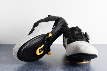 Pair of road cycling shoes with the automatic cleats assembled.