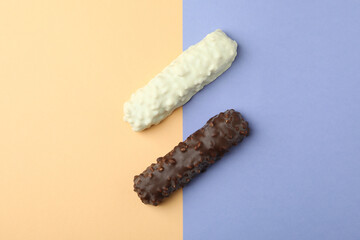 Tasty candy bars on two tone background