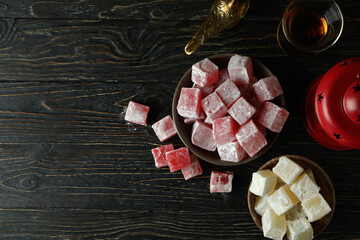 Concept of tasty food with turkish delight on wooden table - obrazy, fototapety, plakaty