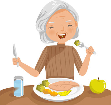 Elderly Woman Eating. She Is Sitting Eat Fish Steak On The Table, Apple And Glass