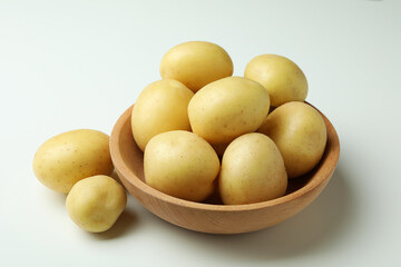 Bowl of young potato on white background