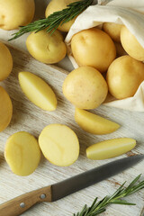 Board with tasty young potato, top view