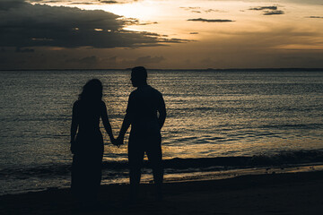 Couple walking in a historic city, old streets, historic mansions, lamps, historic heritage, beach