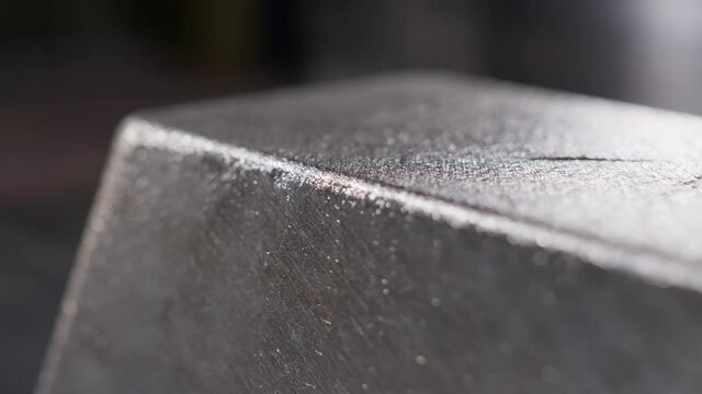 Close up at the edges of processed and polished silver bar at the factory