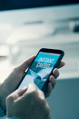 man reads text instant credit in his smartphone