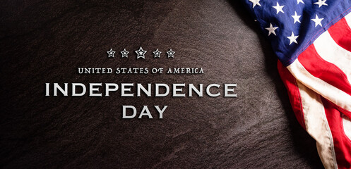 Fototapeta na wymiar Happy Independence day: 4th of July, American flag on dark stone background with the text.