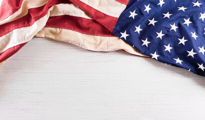 Happy Independence day: 4th of July, American flag on white wooden background.
