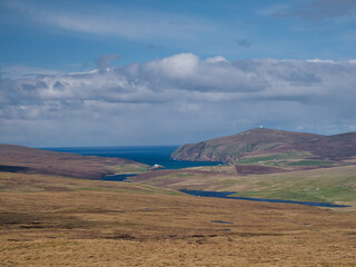 A view across open moorland on the Shetland island of Unst from Valla Field to Burra Firth and the...