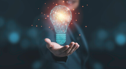 Businessman holding drawing glowing lightbulb, creative thinking ideas and innovation concept.