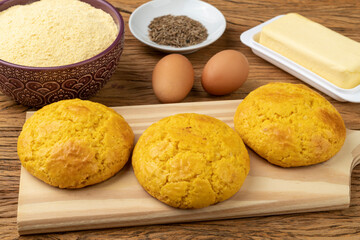 Broa, typical brazilian corn flour bread with ingredients. Butter, eggs, herbs and fuba, corn flour