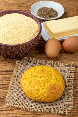 Broa, typical brazilian corn flour bread with ingredients. Butter, eggs, herbs and fuba, corn flour
