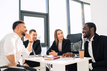 Office meeting of a group of young company workers