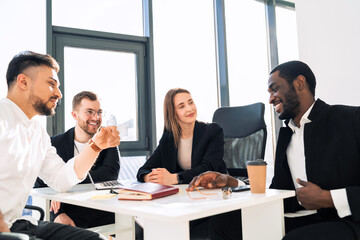 Office meeting of a group of young company workers