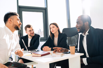 Office meeting of a group of young company workers