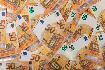 Background with fifty euro banknotes, a lot of money