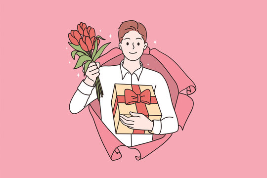 Saint Valentines Day Celebration Concept. Young Smiling Handsome Man Cartoon Character Standing Looking From Pink Damaged Paper Holding Flowers And Gift Box In Hands Vector Illustration 