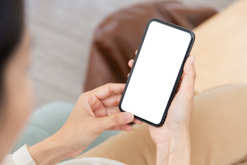 cell phone blank white screen mockup.woman hand holding texting using mobile on desk at office.background empty space for advertise.work people contact marketing business,technology
