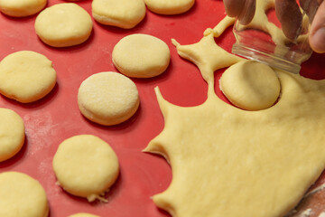 circles of dough cut on a silicone dough mat