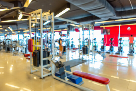 Abstract blur of defocused modern gym interior and fitness health club with sports exercise equipment,fitness center interior background.