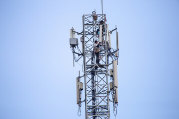 transmitter atop a cell phone pole About to be upgraded from 4g to 5g. High-risk electrical...