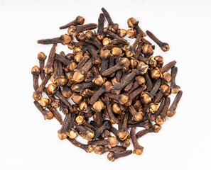 pile of whole dried cloves close up on gray