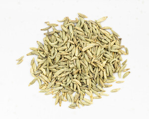 top view of pile of anise seeds close up on gray