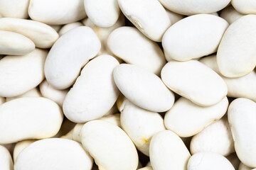 background - many uncooked white beans close up
