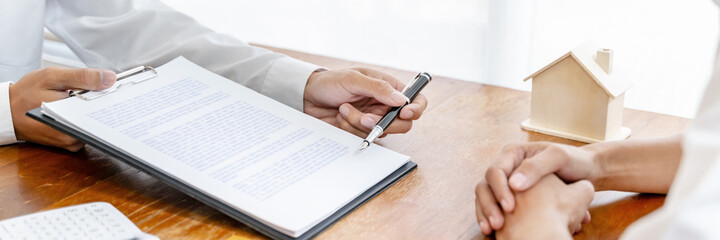 Fototapeta premium home loan insurance.&nbsp;.Real estate broker and client&nbsp;&nbsp;sign contract insurance agreement document. Business meeting concept