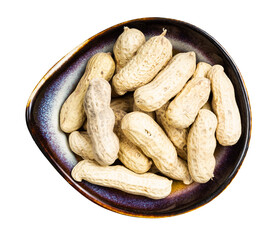 top view of whole peanuts in ceramic bowl isolated