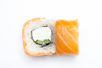 Philadelphia roll sushi with salmon, shrimps, avocado, cream cheese. Sushi menu. Japanese food..Sushi roll isolated on white close up
