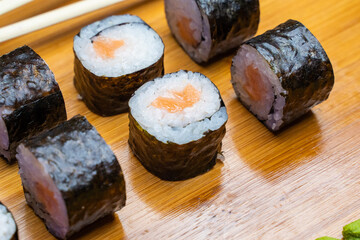 Philadelphia roll sushi with salmon, shrimps, avocado, cream cheese. Sushi menu. Japanese food..Sushi roll isolated on white close up