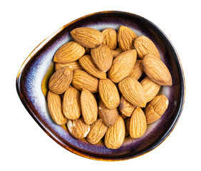 raw almond seeds in ceramic bowl isolated