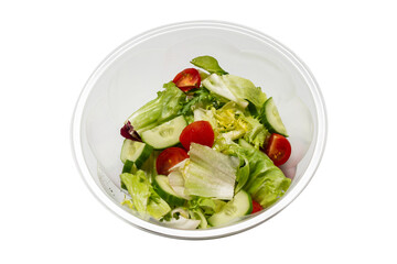 Salad with fresh vegetables isolated on a white background.